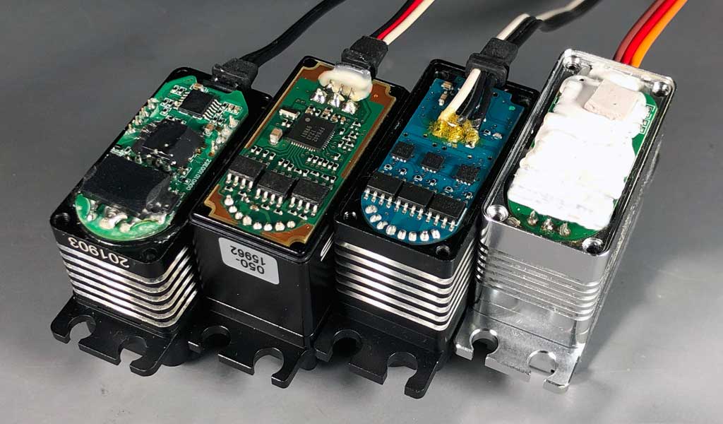 Close up of competing servo electronics showing lack of potting compound