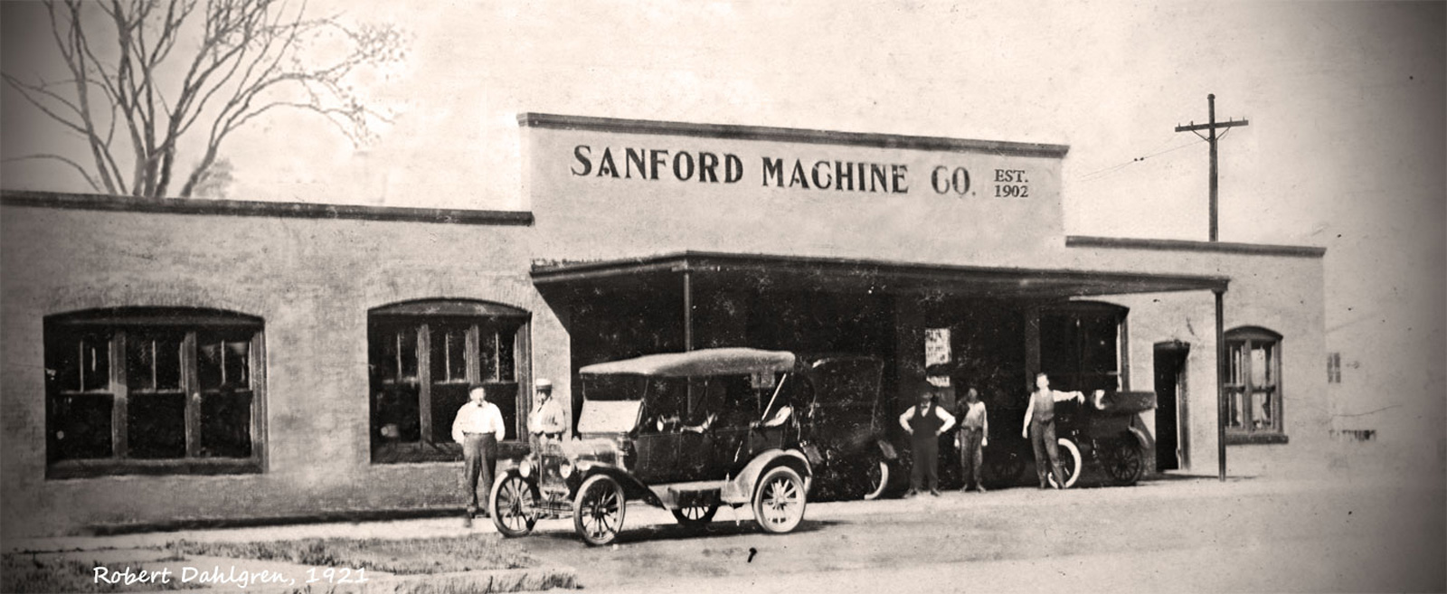 image showing an old building with the name Sanford Machine on it.